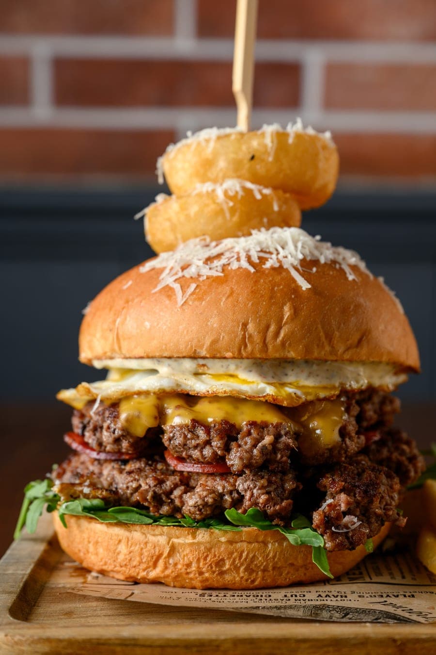 Stacked burger with onion rings
